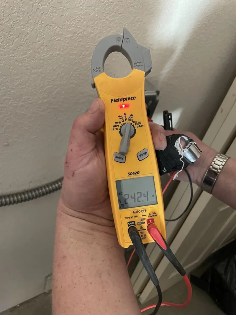 Voltage testing with clamp meter during Generator Installation in San Bruno